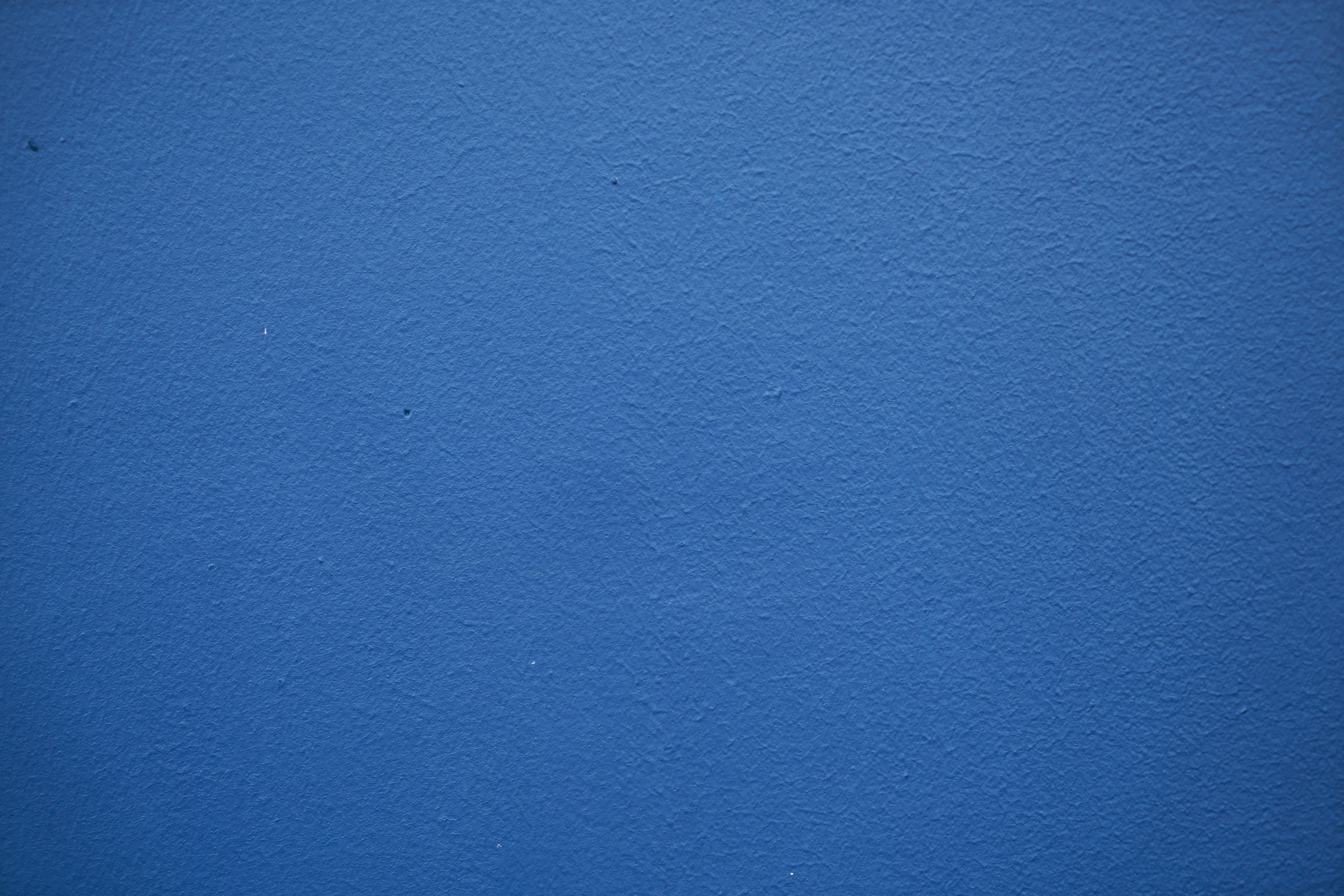 blue painted wall with white paint